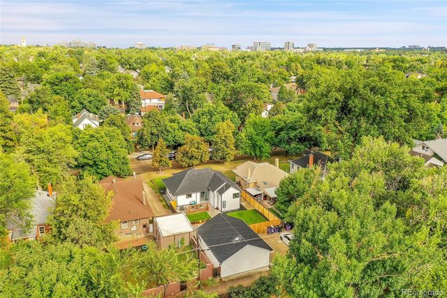 an aerial view of a house with a yard