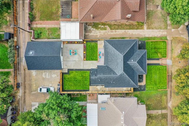 an aerial view of house with a yard