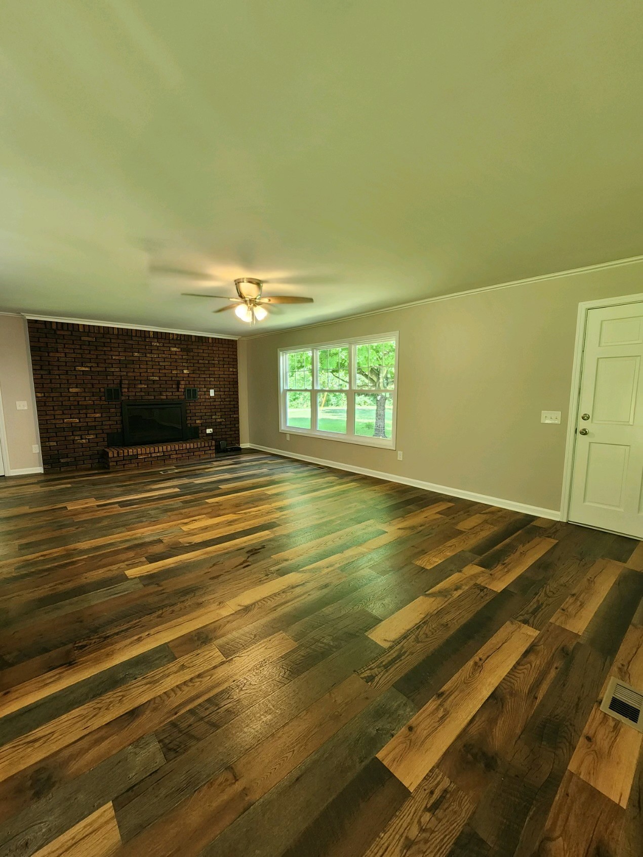 804 Crews Hollow Road Manchester, TN 37355 - Photo 12 of 29 Large Family Room Family room offers a nice brick fireplace new flooring and paint