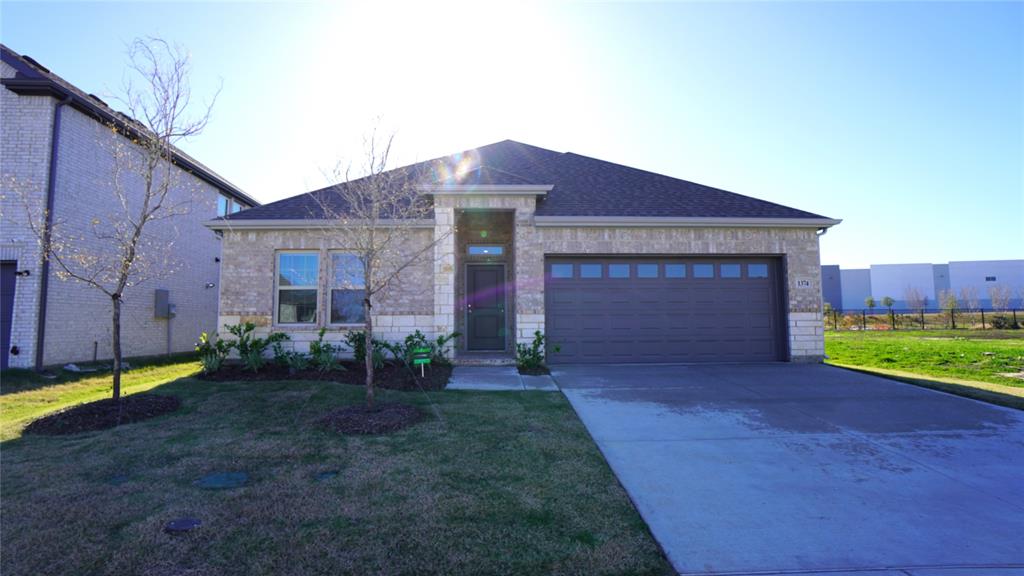 a view of a brick house with a yard