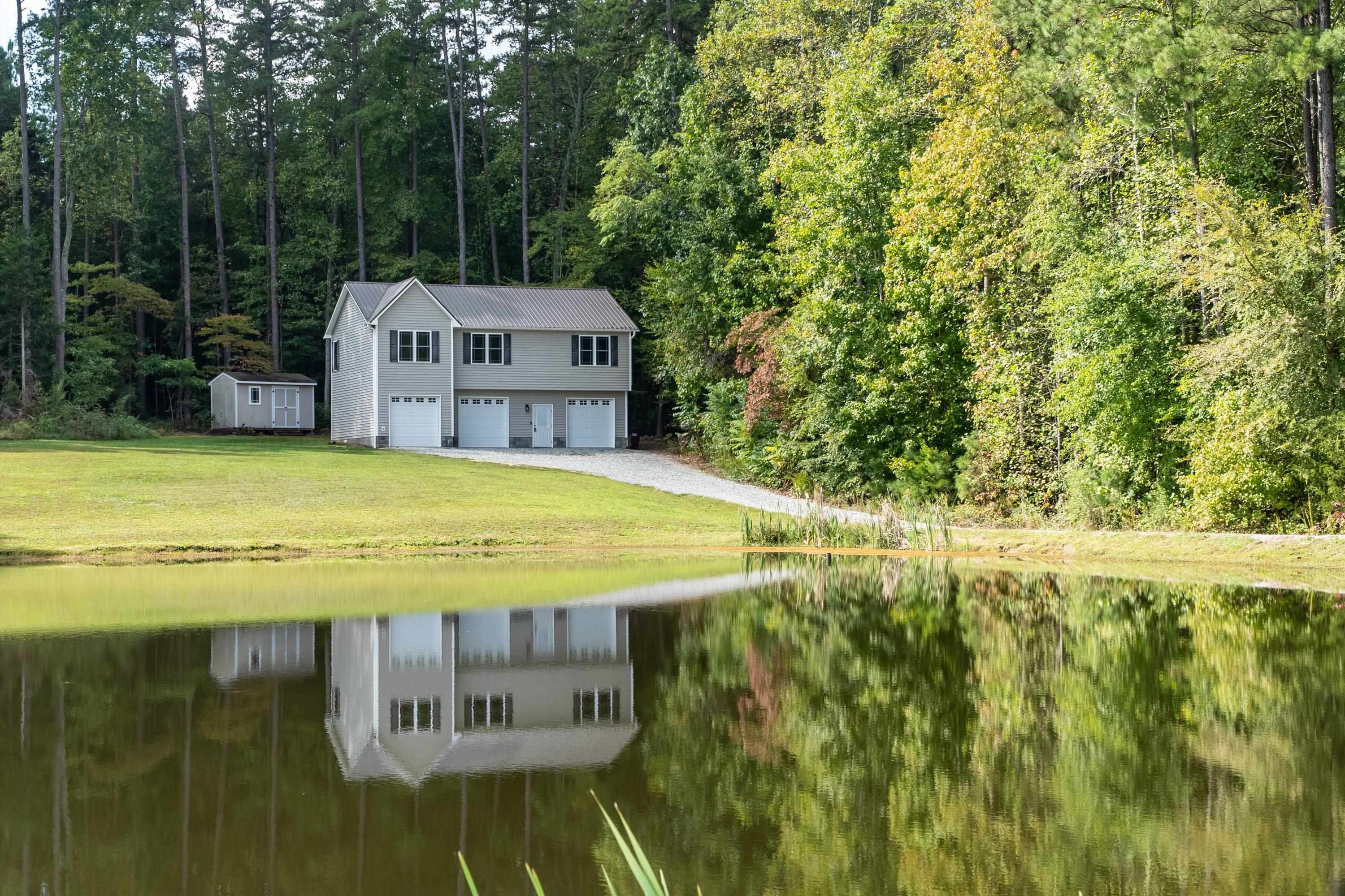 345 Fieldstone Road Roxboro, NC 27574 - Photo 3 of 34 a view of a swimming pool with a garden