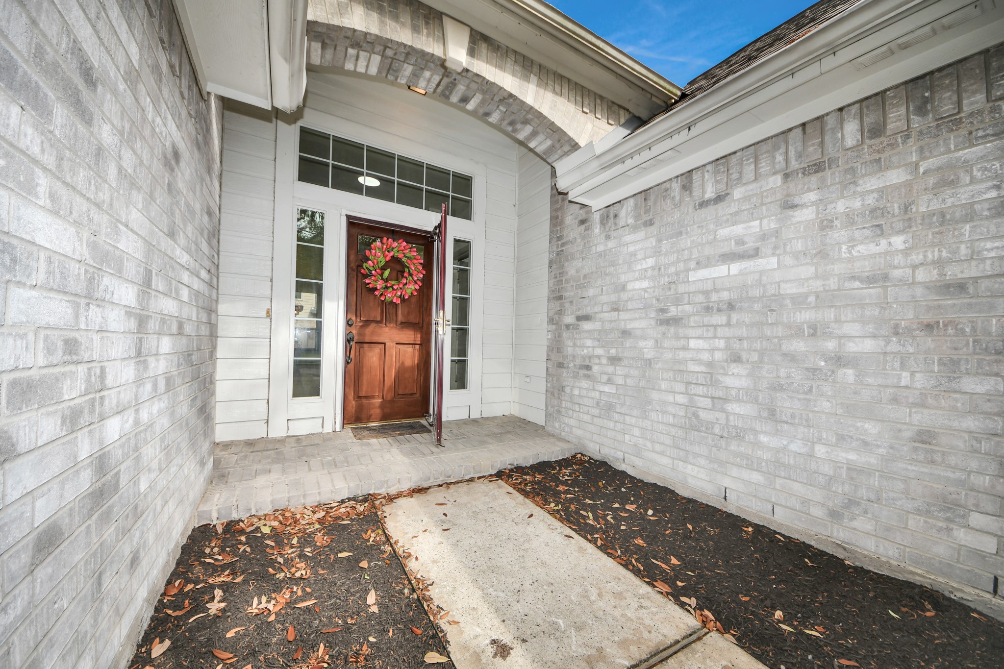 14423 Gadwall Court Houston, TX 77044 - Photo 2 of 42 a view of a hallway with wooden floor and a door