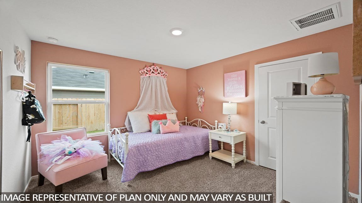 19968 Hilbert Road New Caney, TX 77357 - Photo 12 of 21 a bedroom with furniture and a large window