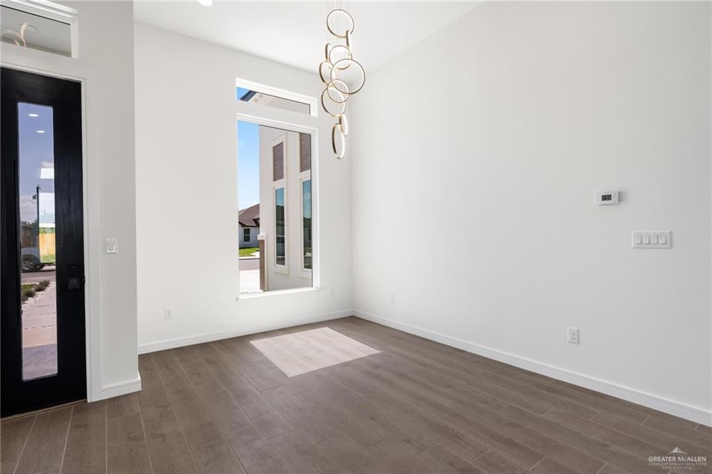 505 Freedom Way Weslaco, TX 78596 - Photo 6 of 20 a view of livingroom with hardwood floor and window
