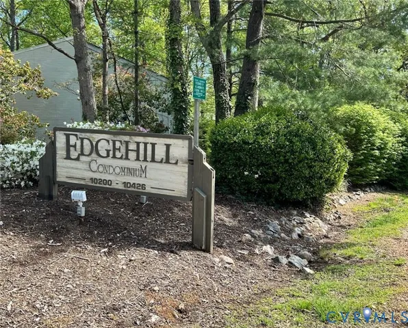 a view of a wooden house with a bench