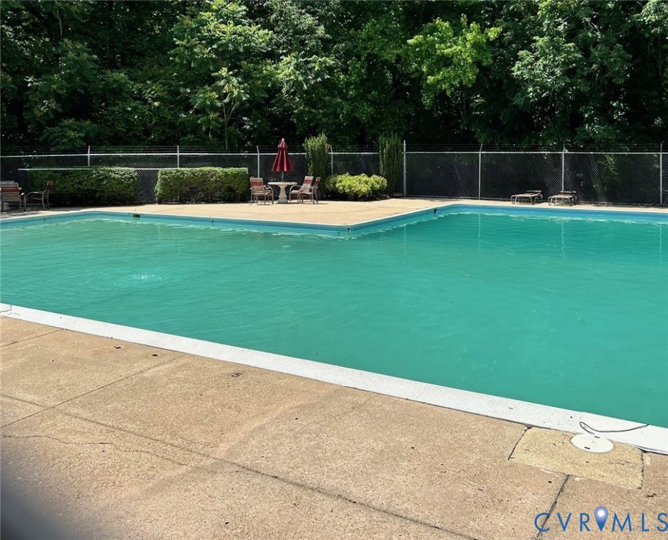 10396 Iron Mill Road North Chesterfield, VA 23235 - Photo 19 of 23 a swimming pool with a yard