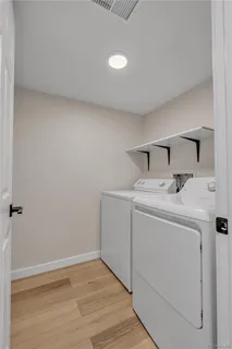 a bathroom with a sink vanity and mirror