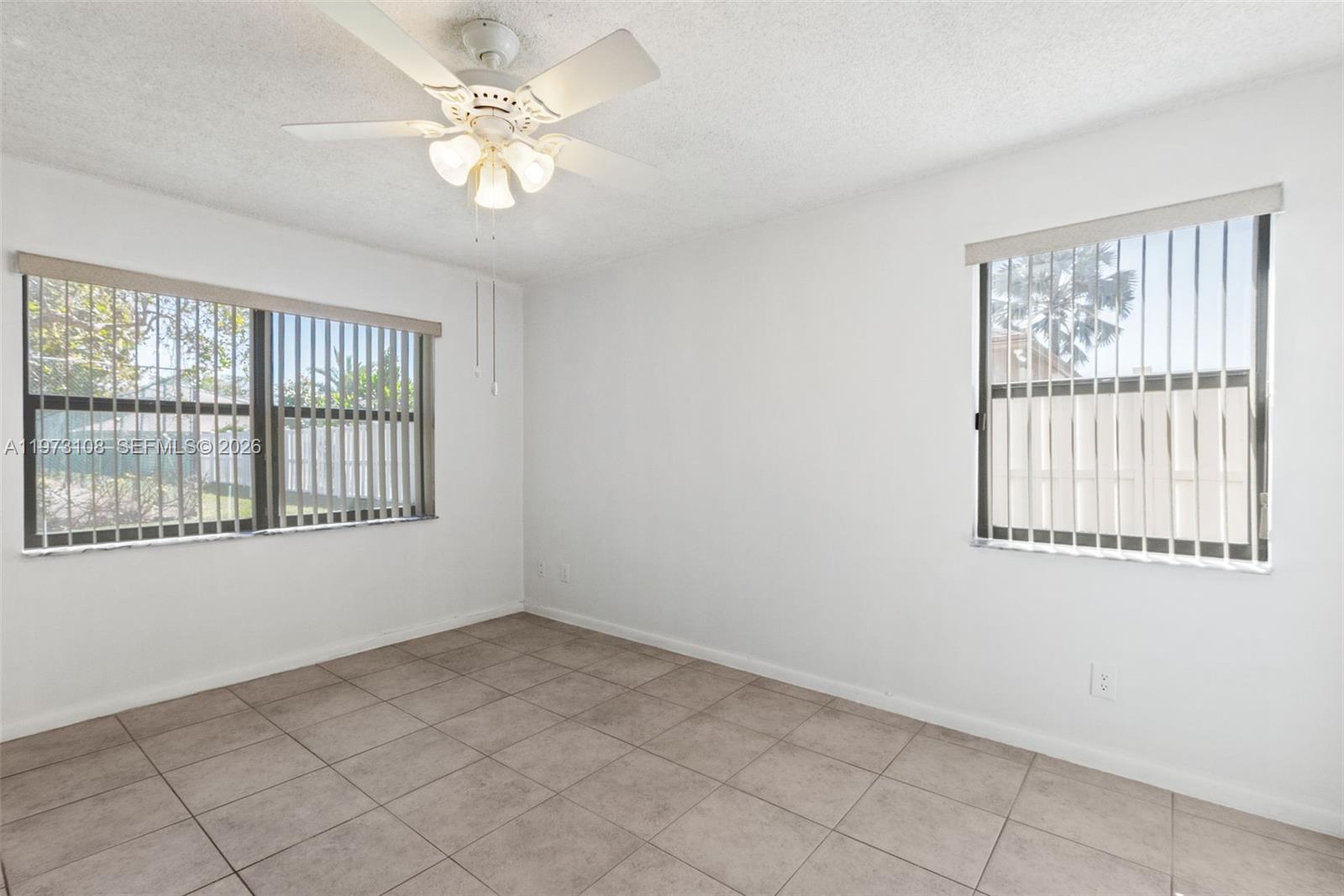 5356 Gate Lake Road, Unit 5356 Tamarac, FL 33319 - Photo 13 of 25 a view of an empty room with a window