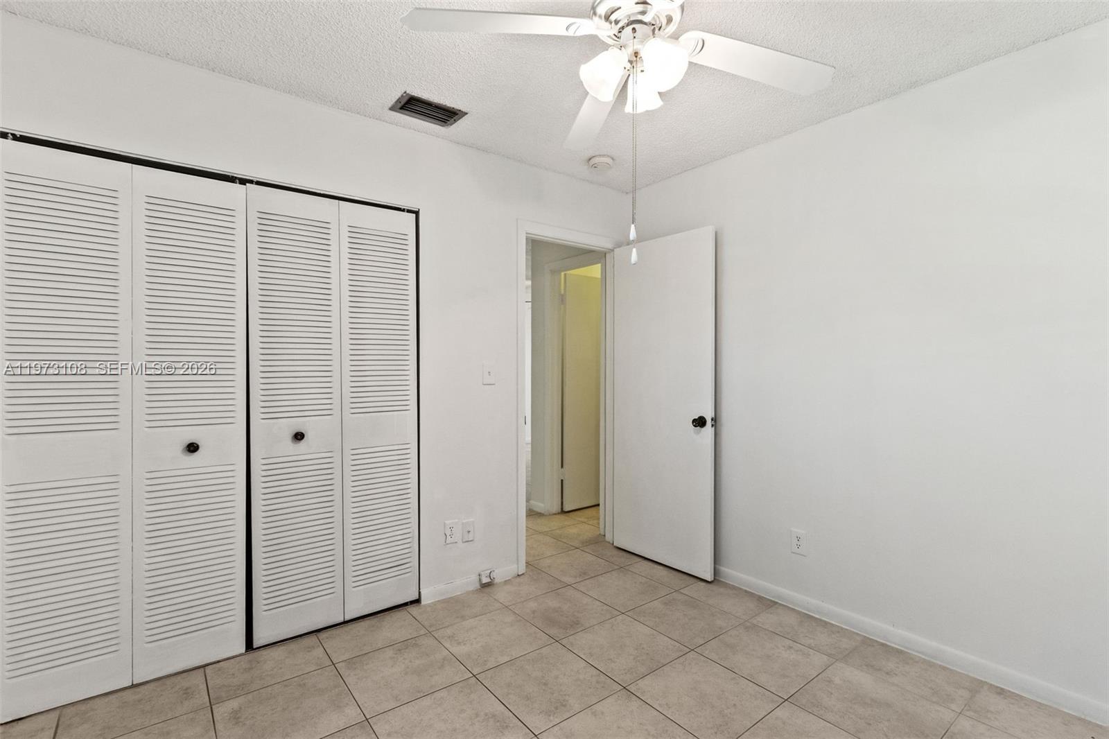 5356 Gate Lake Road, Unit 5356 Tamarac, FL 33319 - Photo 15 of 25 wooden floor in an empty room