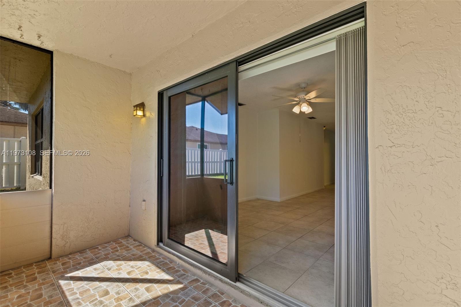 5356 Gate Lake Road, Unit 5356 Tamarac, FL 33319 - Photo 18 of 25 a view of a bathroom with a glass door and a glass door