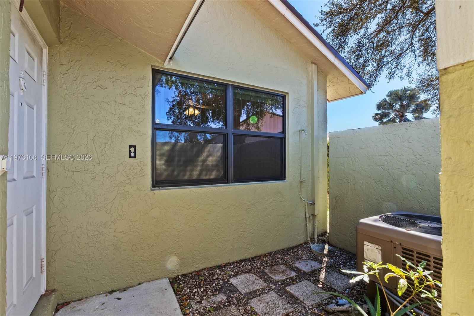 5356 Gate Lake Road, Unit 5356 Tamarac, FL 33319 - Photo 20 of 25 a bathroom with a toilet and a shower curtain