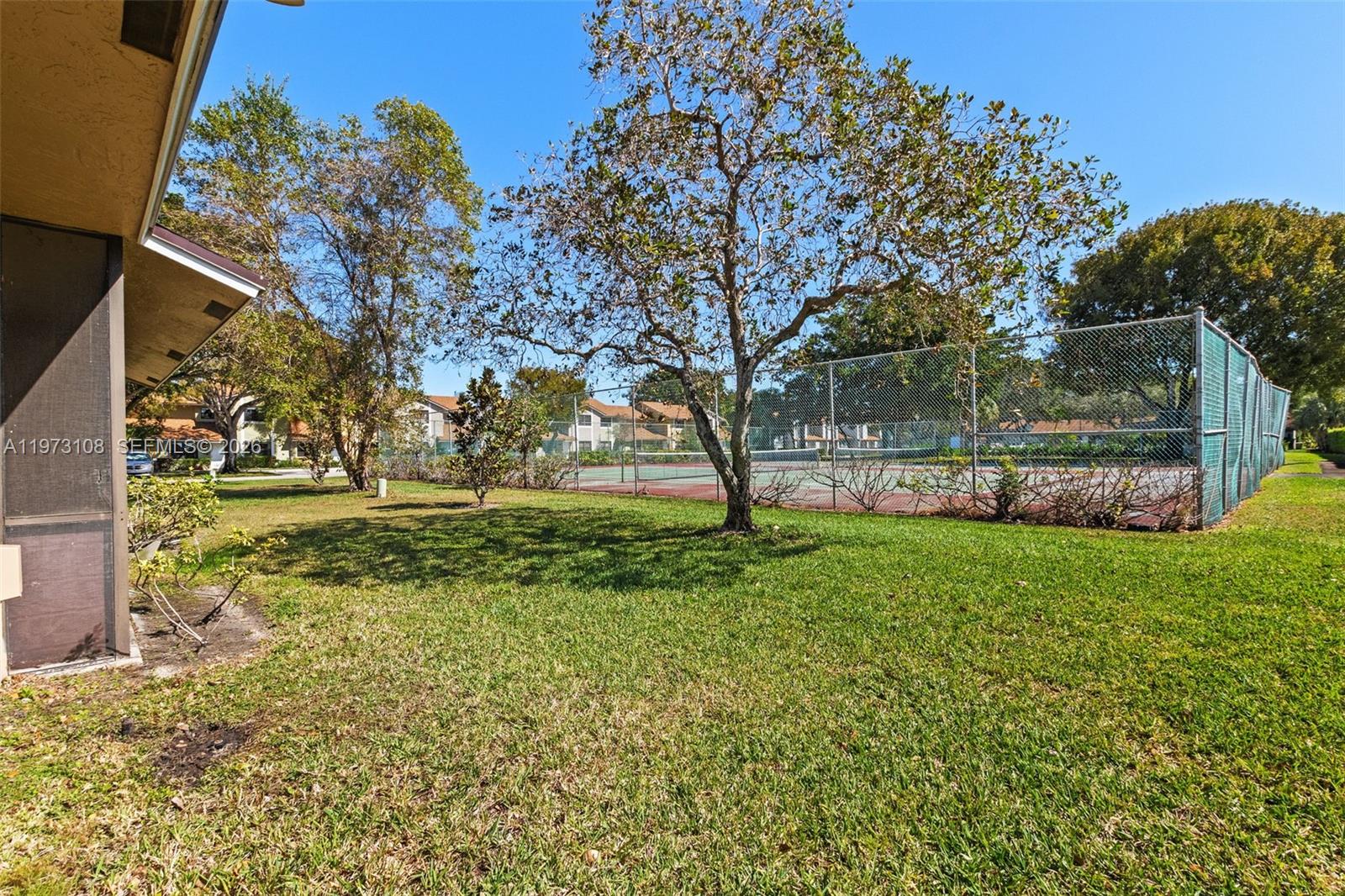 5356 Gate Lake Road, Unit 5356 Tamarac, FL 33319 - Photo 21 of 25 a view of yard with tree