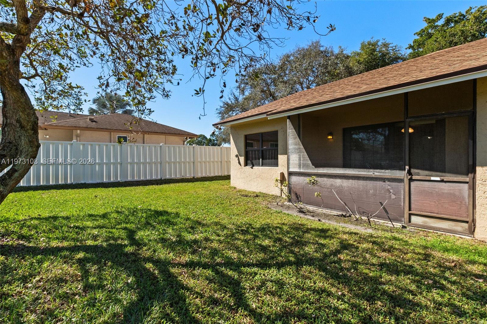 5356 Gate Lake Road, Unit 5356 Tamarac, FL 33319 - Photo 22 of 25 a view of a backyard