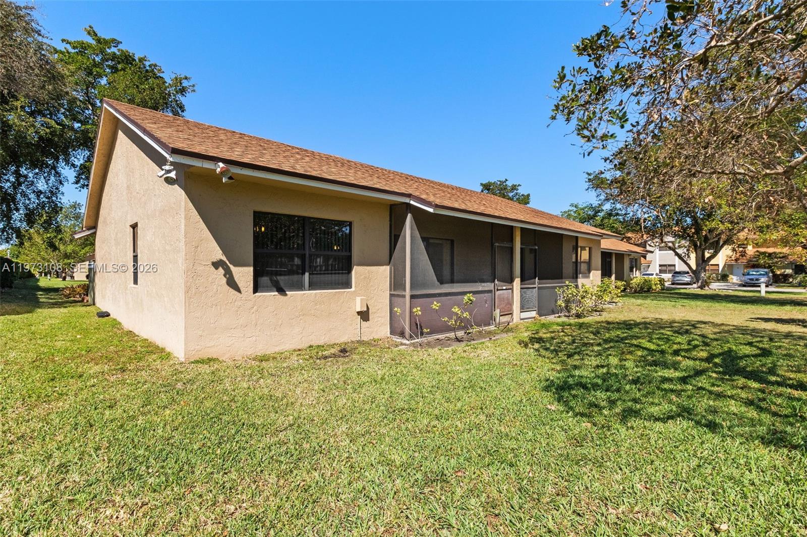 5356 Gate Lake Road, Unit 5356 Tamarac, FL 33319 - Photo 3 of 25 a view of a house with a yard