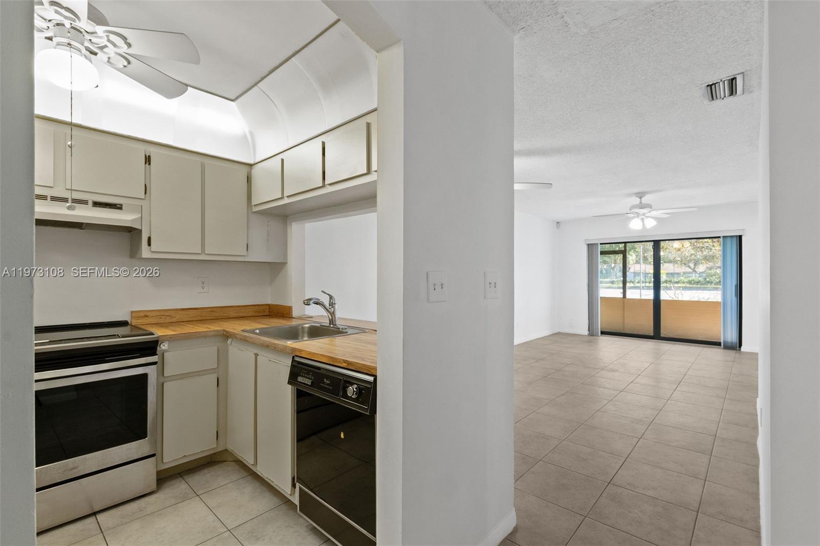 5356 Gate Lake Road, Unit 5356 Tamarac, FL 33319 - Photo 4 of 25 a kitchen with a stove oven and sink