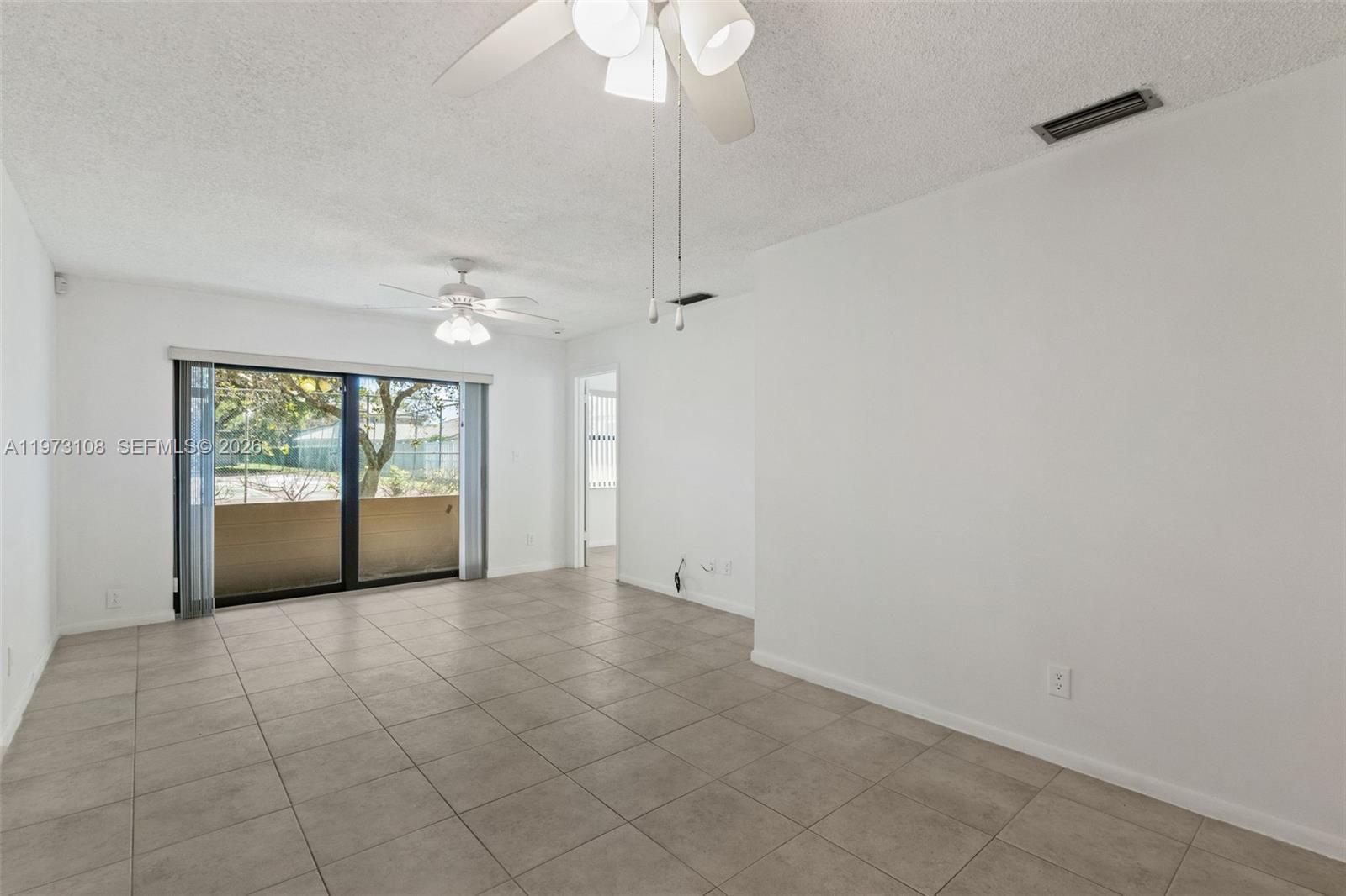 5356 Gate Lake Road, Unit 5356 Tamarac, FL 33319 - Photo 7 of 25 a view of an empty room with a window