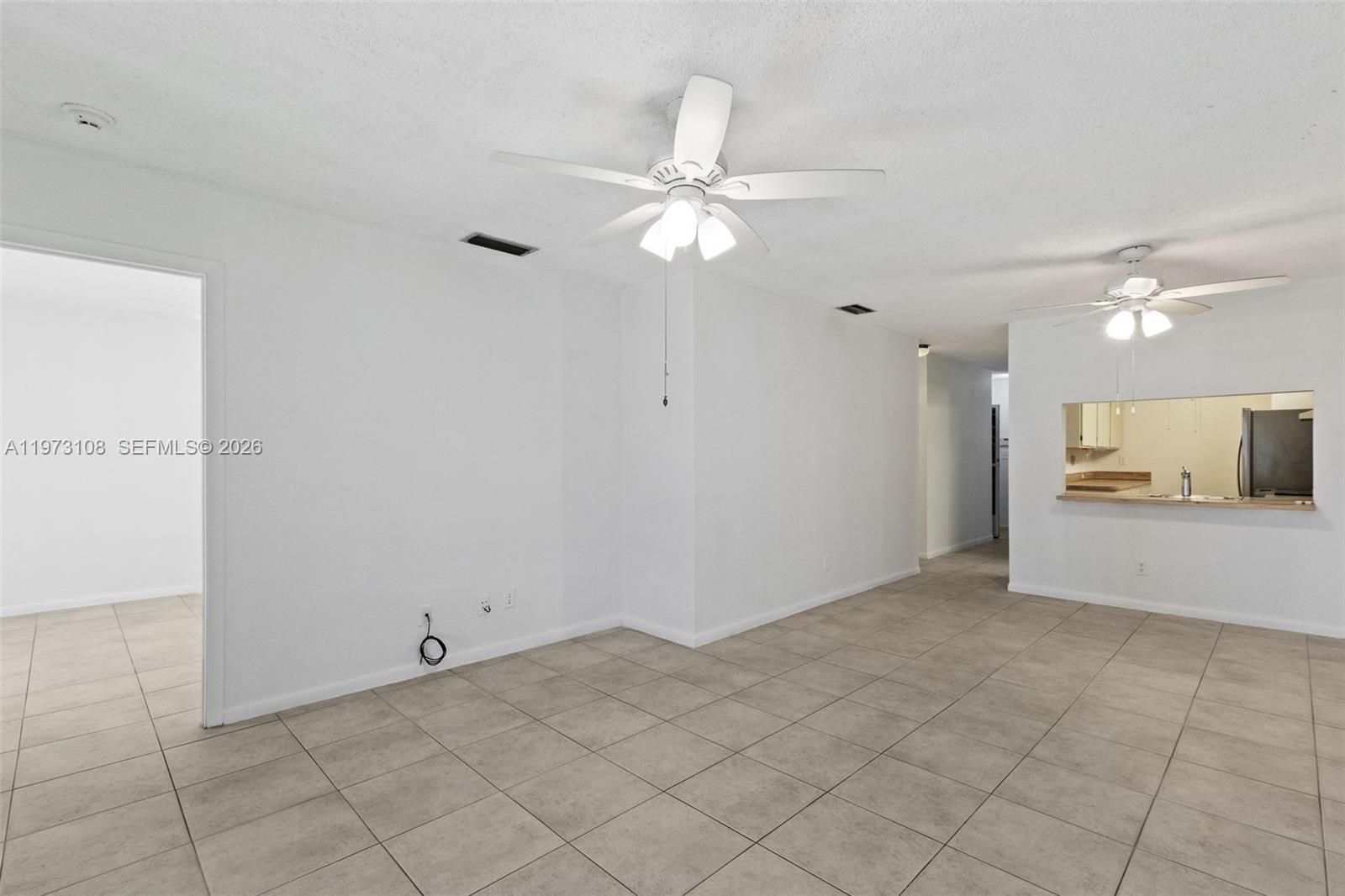 5356 Gate Lake Road, Unit 5356 Tamarac, FL 33319 - Photo 8 of 25 a view of an empty room and kitchen view