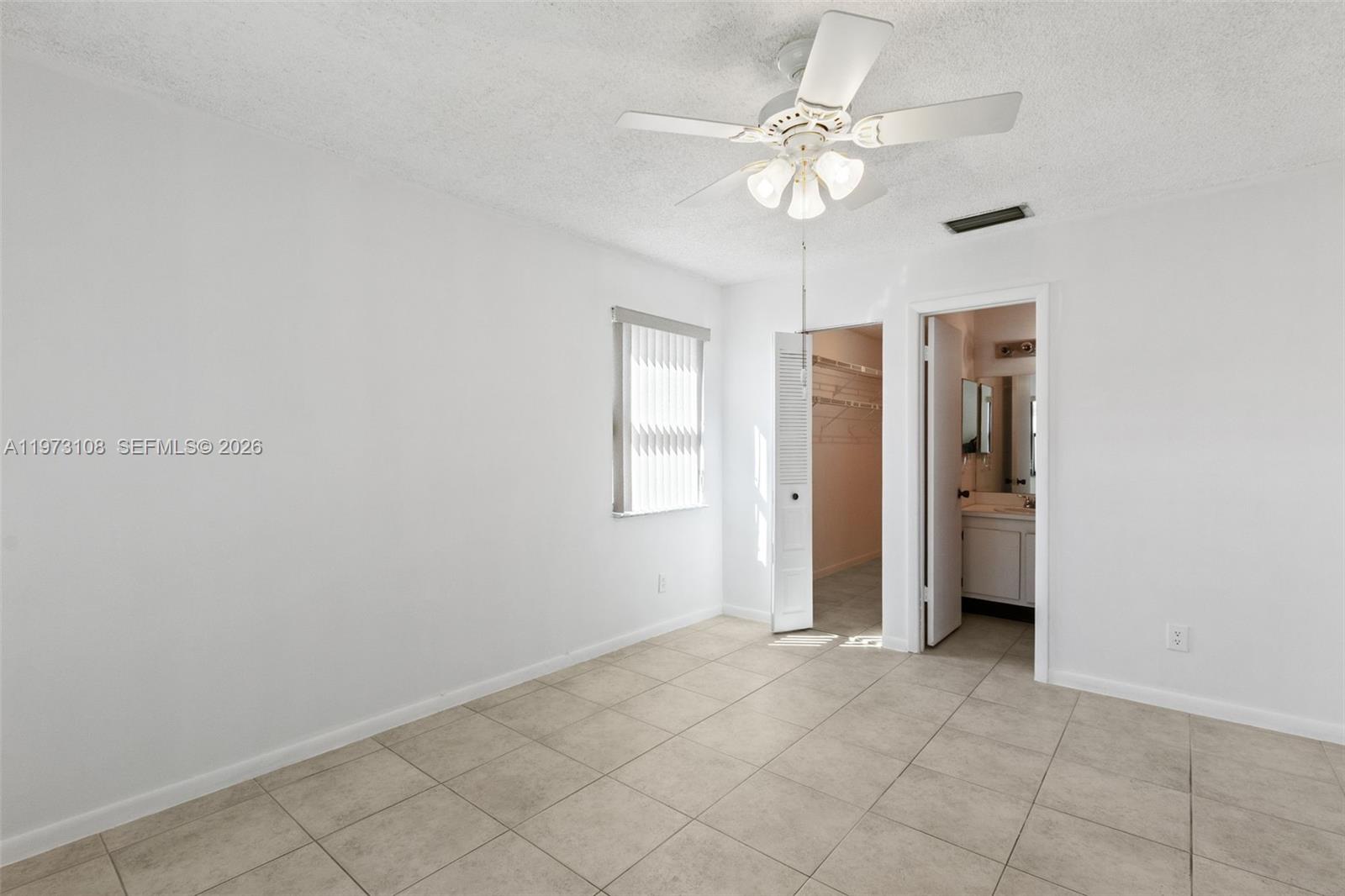 5356 Gate Lake Road, Unit 5356 Tamarac, FL 33319 - Photo 9 of 25 a view of an empty room with a window