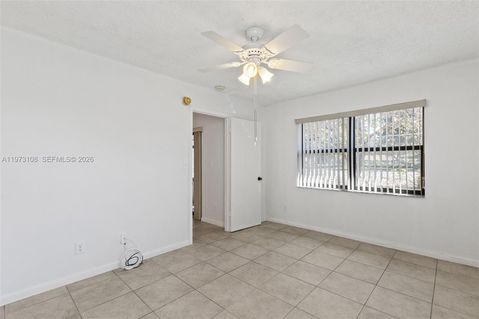5356 Gate Lake Road, Unit 5356 Tamarac, FL 33319 - Photo 10 of 25 a view of an empty room with a window
