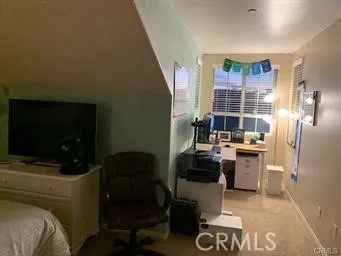 a kitchen with a refrigerator and a stove top oven