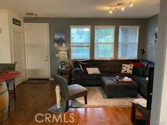a living room with furniture and a large window