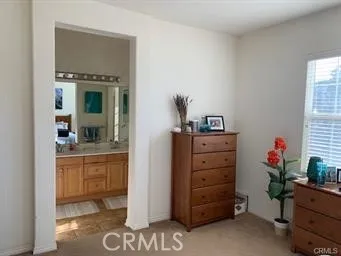 a room with furniture and mirror