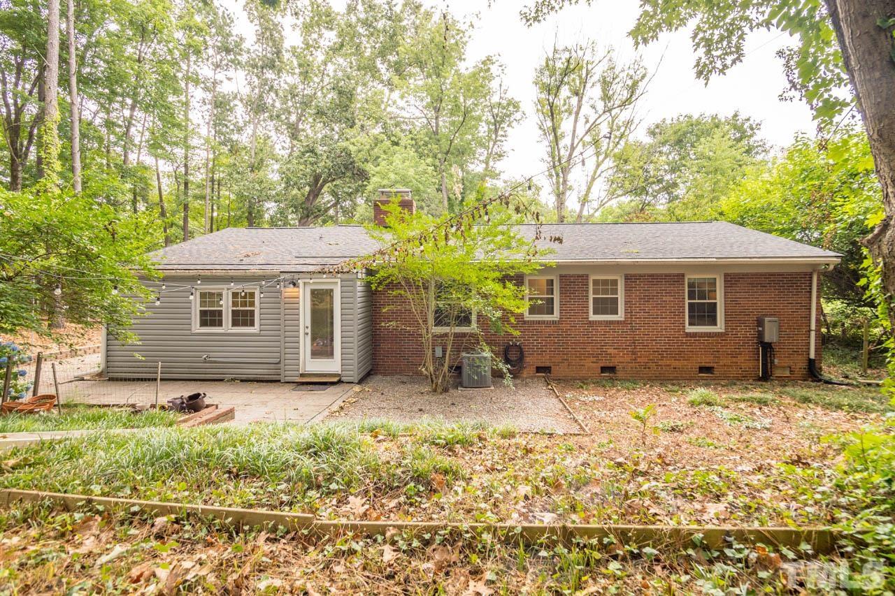 810 Brent Road Raleigh, NC 27606 - Photo 39 of 57 a backyard of a house with yard table and chairs