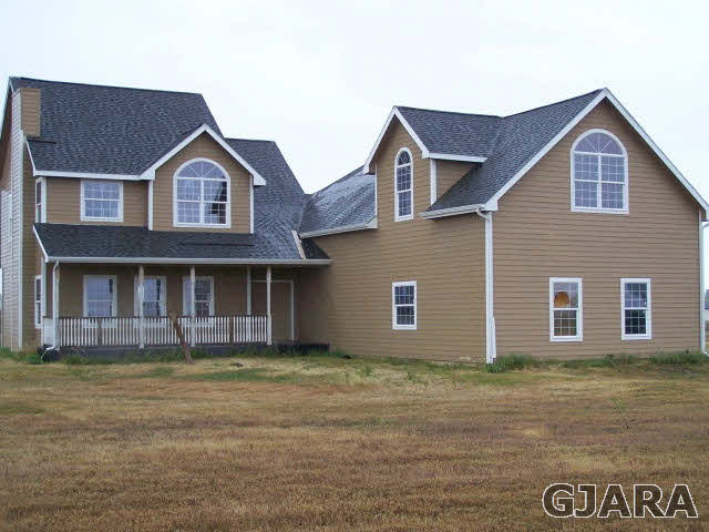 1492 18 Road Fruita, CO 81521 - Photo 1 of 1 a front view of a house with a garden