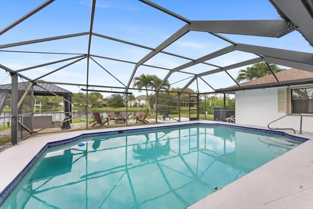 a view of a swimming pool with a patio