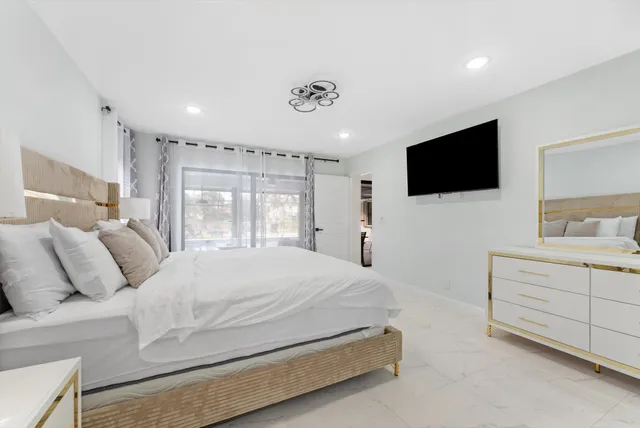 a bathroom with a granite countertop sink mirror and