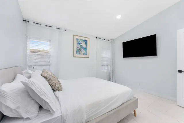 a bathroom with a shower and a sink