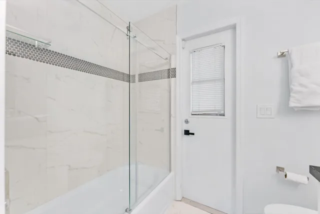 a bedroom with a large bed and a table