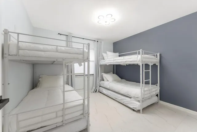 a view of swimming pool with outdoor seating and plants