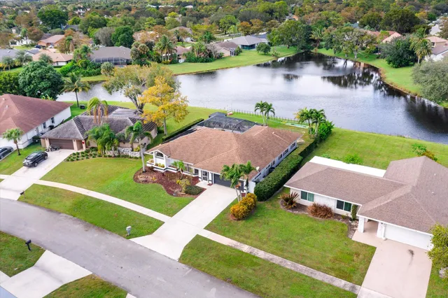 a picture of a room with a white wall and mirror