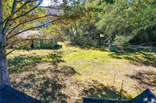 a view of swimming pool from a yard
