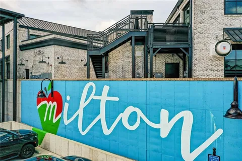 a front view of a building with sitting area