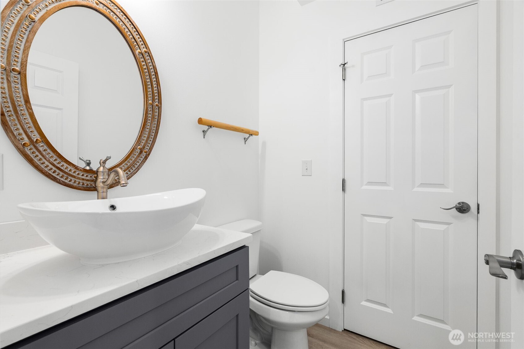 6925 Schweitzer Place Southwest Port Orchard, WA 98367 - Photo 15 of 32 a bathroom with a sink a mirror a toilet and a window