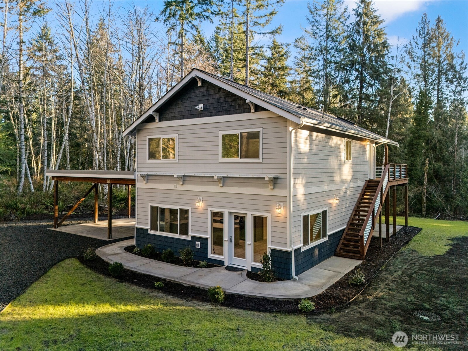 6925 Schweitzer Place Southwest Port Orchard, WA 98367 - Photo 2 of 32 a front view of house with yard and green space