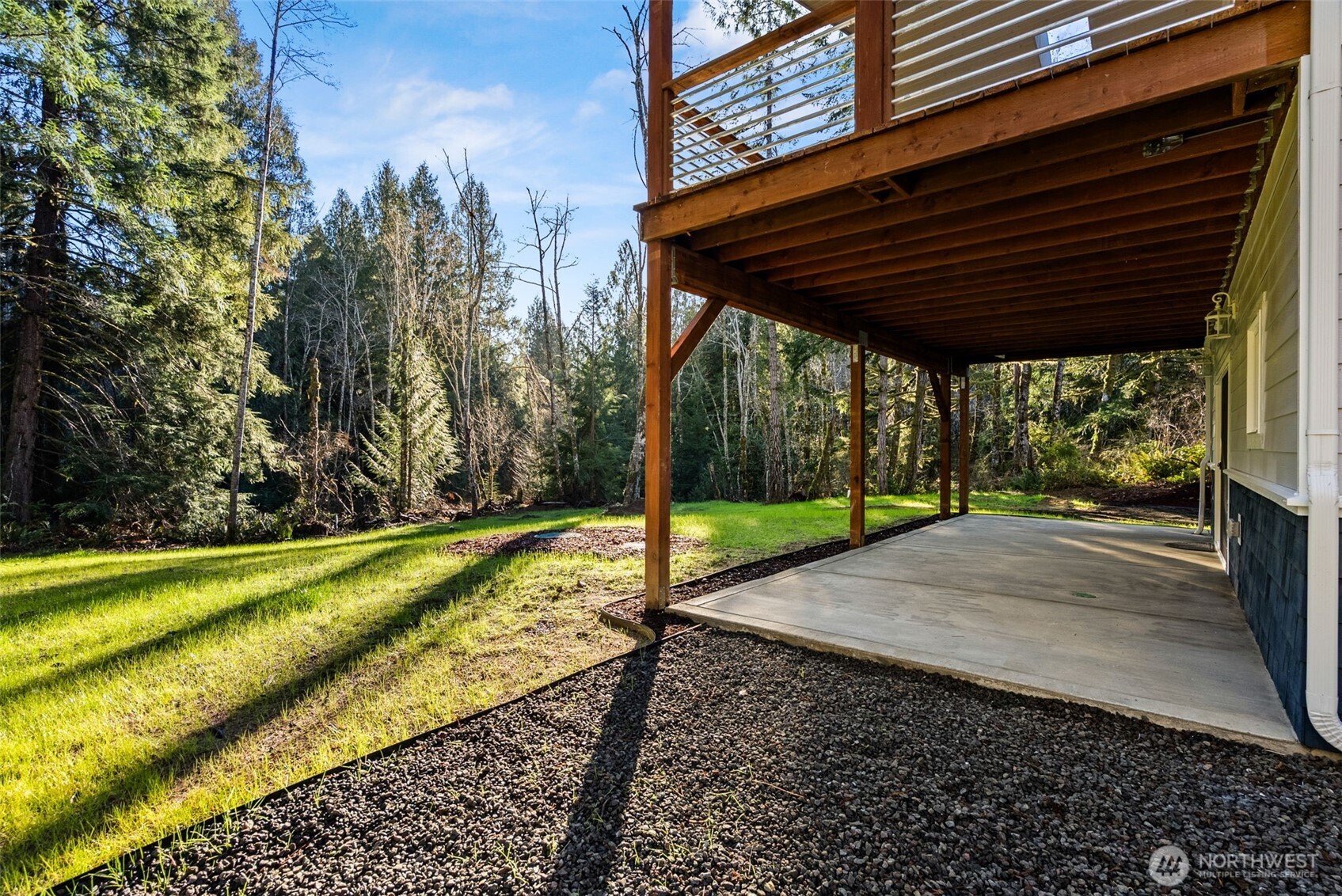 6925 Schweitzer Place Southwest Port Orchard, WA 98367 - Photo 28 of 32 a view of a backyard with a small cabin
