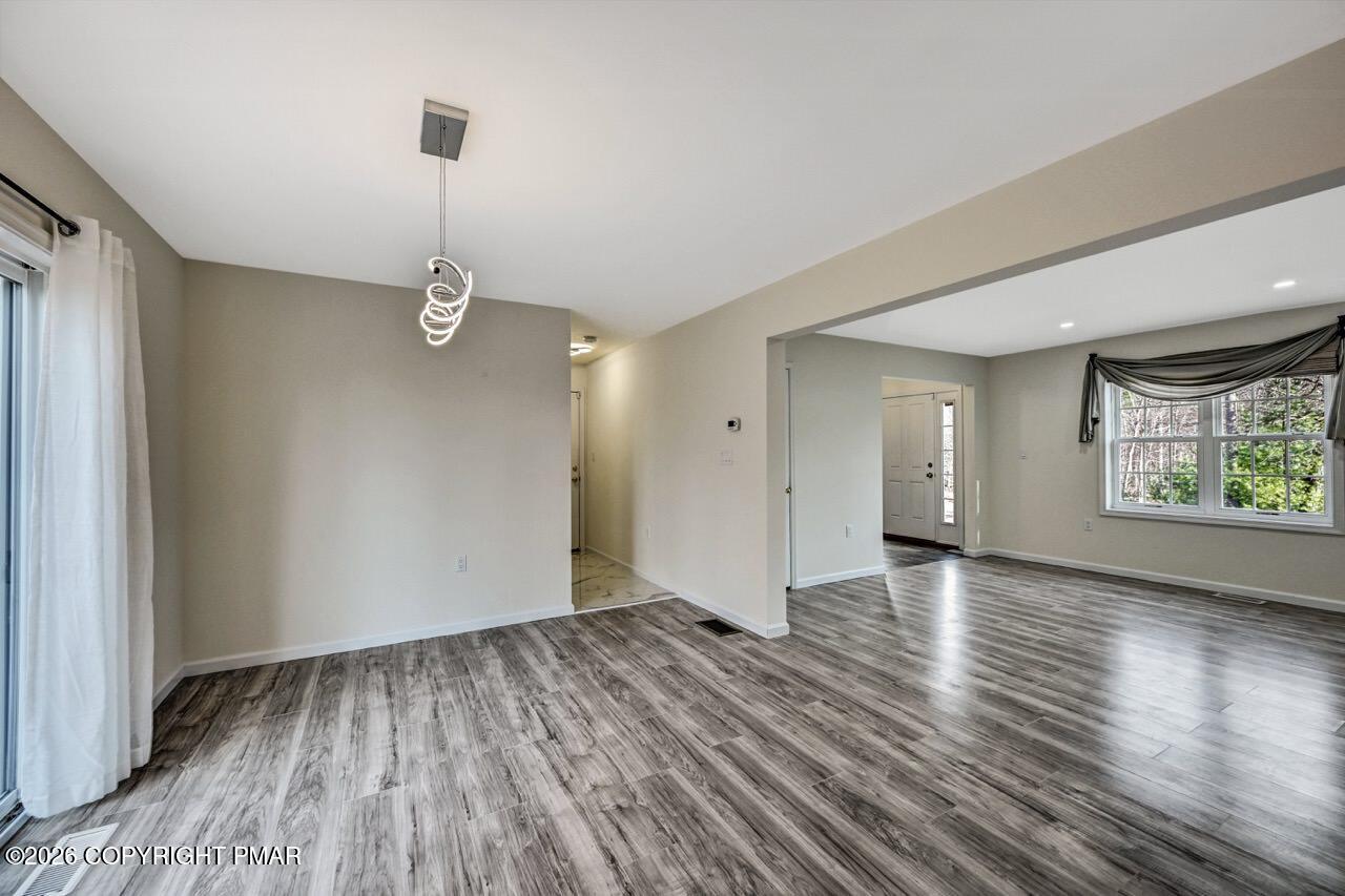 1013 Bear Swamp Road East Stroudsburg, PA 18302 - Photo 11 of 53 a view of empty room with wooden floor and window