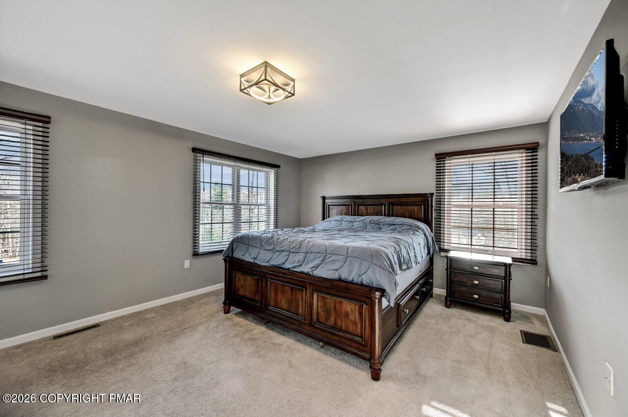 1013 Bear Swamp Road East Stroudsburg, PA 18302 - Photo 23 of 53 a spacious bedroom with a bed and a window