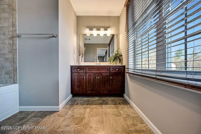 a bathroom with a sink and a large mirror