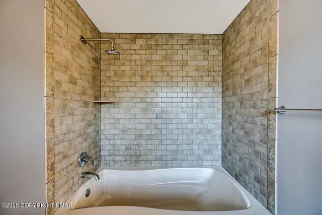 a view of an empty room and a window