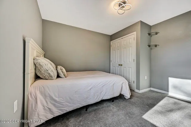 a bathroom with a sink a mirror and a shower