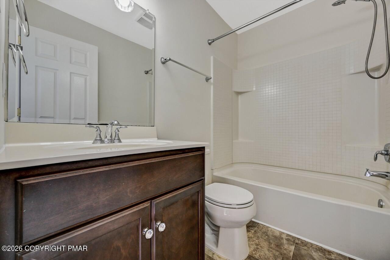 1013 Bear Swamp Road East Stroudsburg, PA 18302 - Photo 35 of 53 a bathroom with a sink a toilet and a bathtub