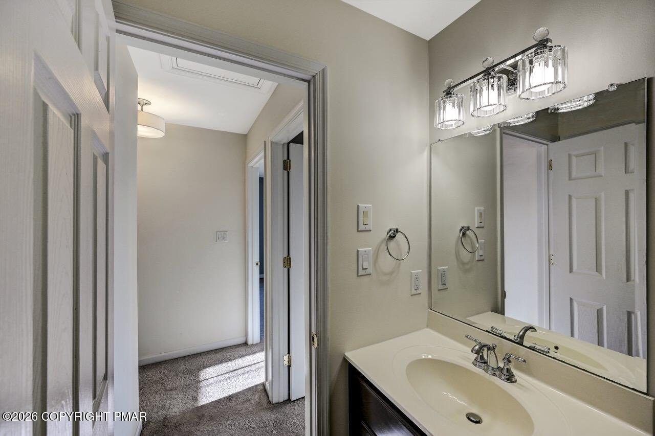 1013 Bear Swamp Road East Stroudsburg, PA 18302 - Photo 36 of 53 a bathroom with a sink a mirror and a shower