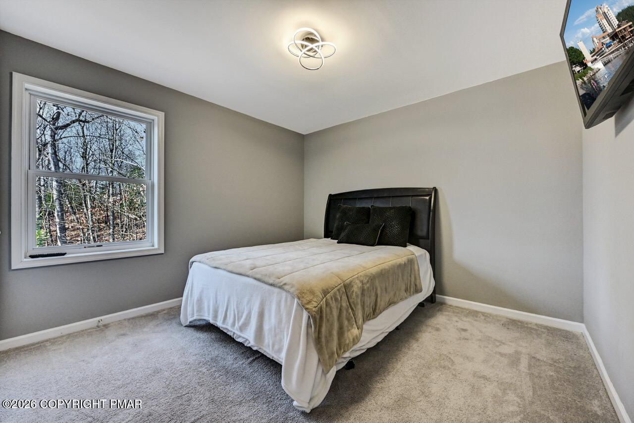 1013 Bear Swamp Road East Stroudsburg, PA 18302 - Photo 37 of 53 a bedroom with a bed and a window