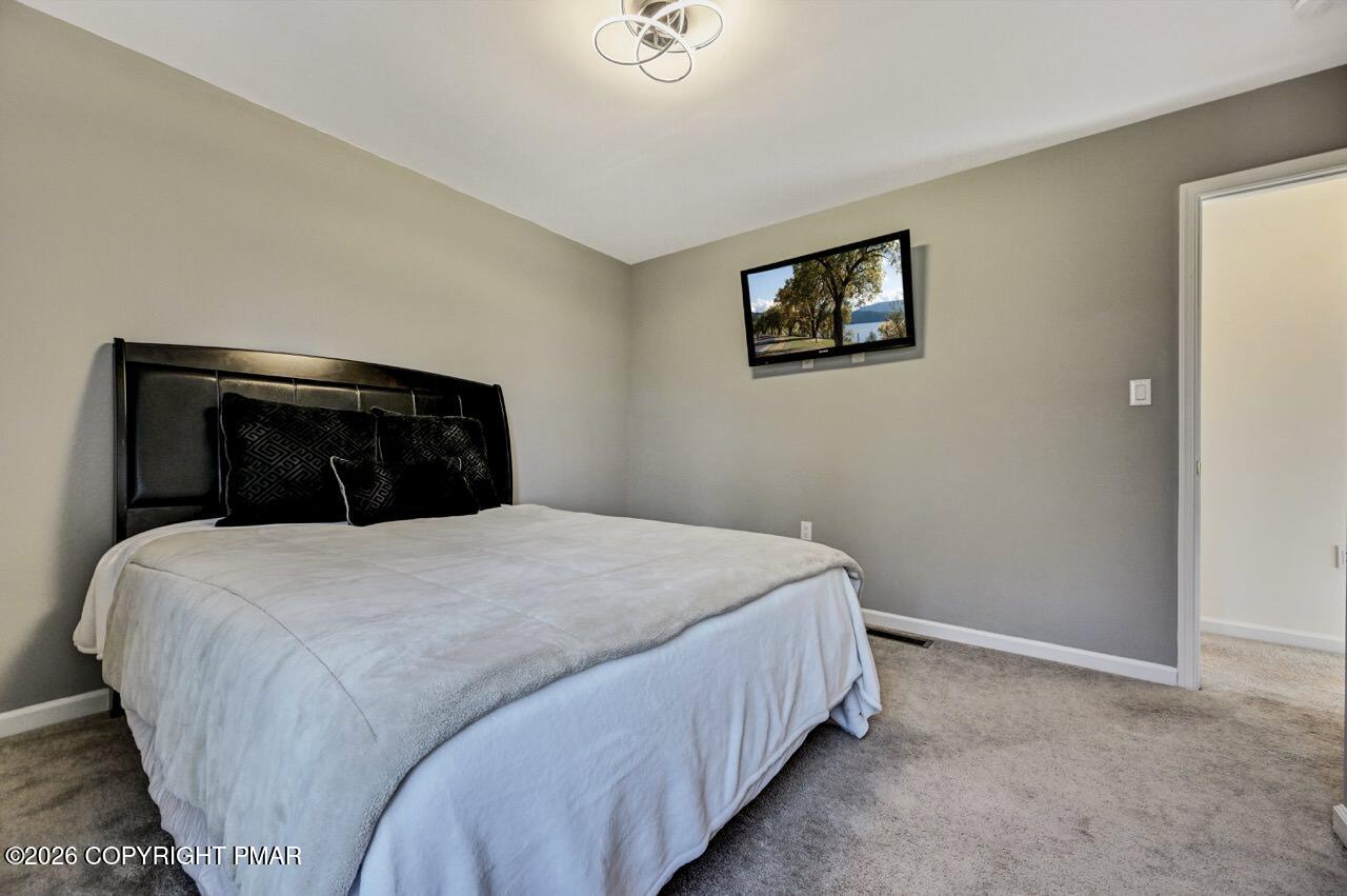 1013 Bear Swamp Road East Stroudsburg, PA 18302 - Photo 38 of 53 a bedroom with a bed and a window