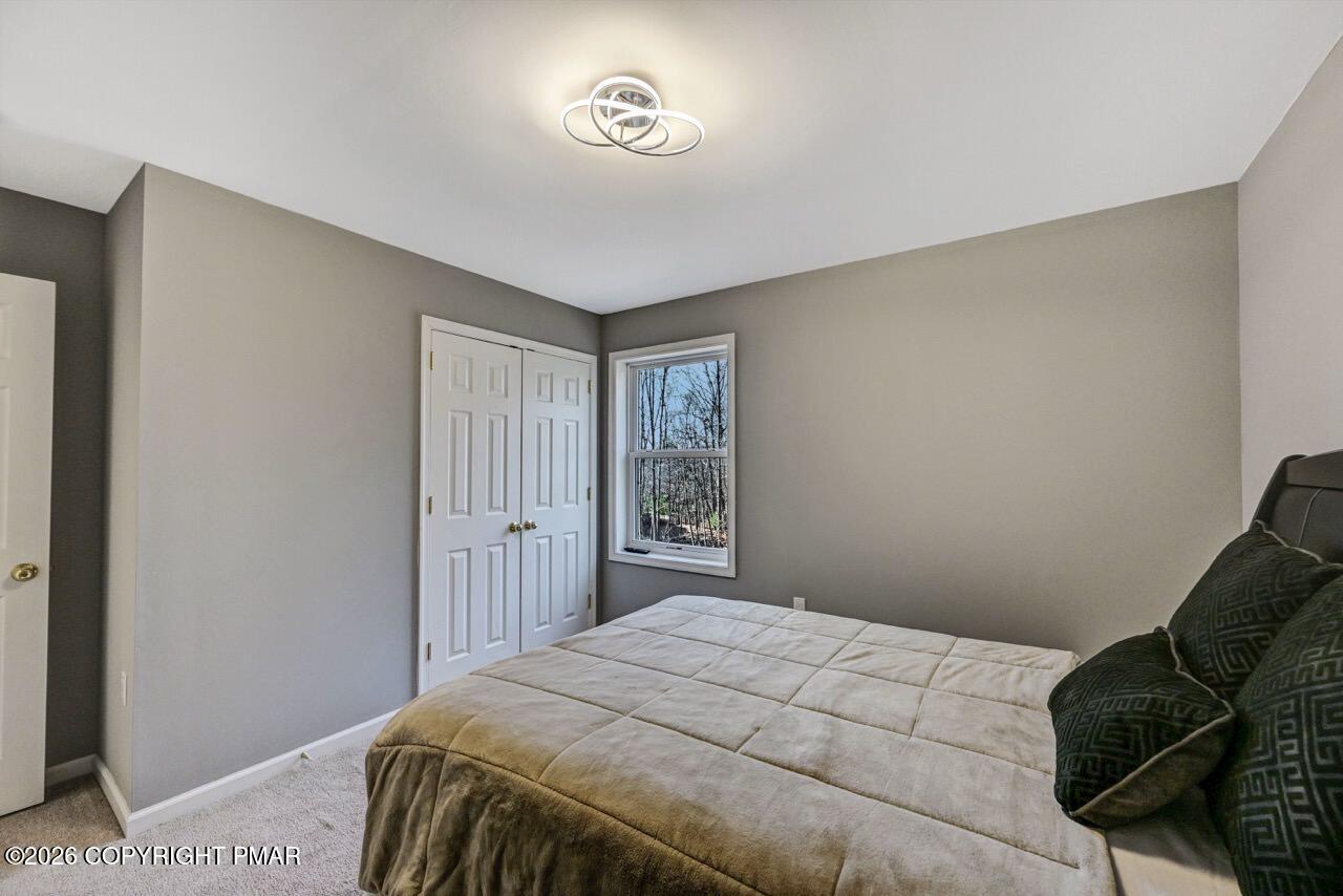 1013 Bear Swamp Road East Stroudsburg, PA 18302 - Photo 39 of 53 a bedroom with a bed and a window