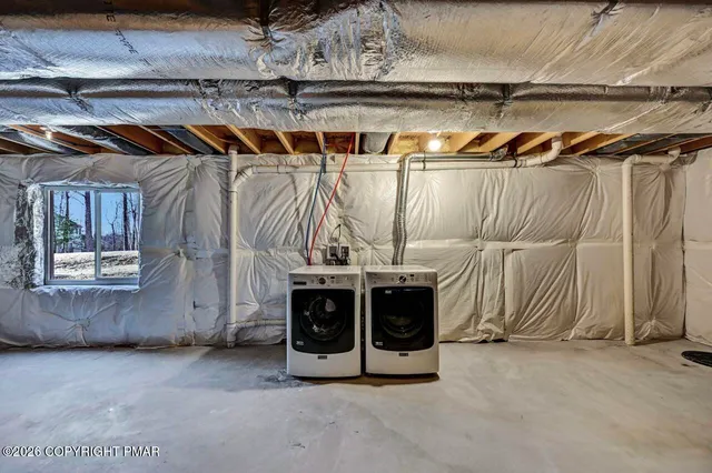 a view of a room with wooden floor and windows